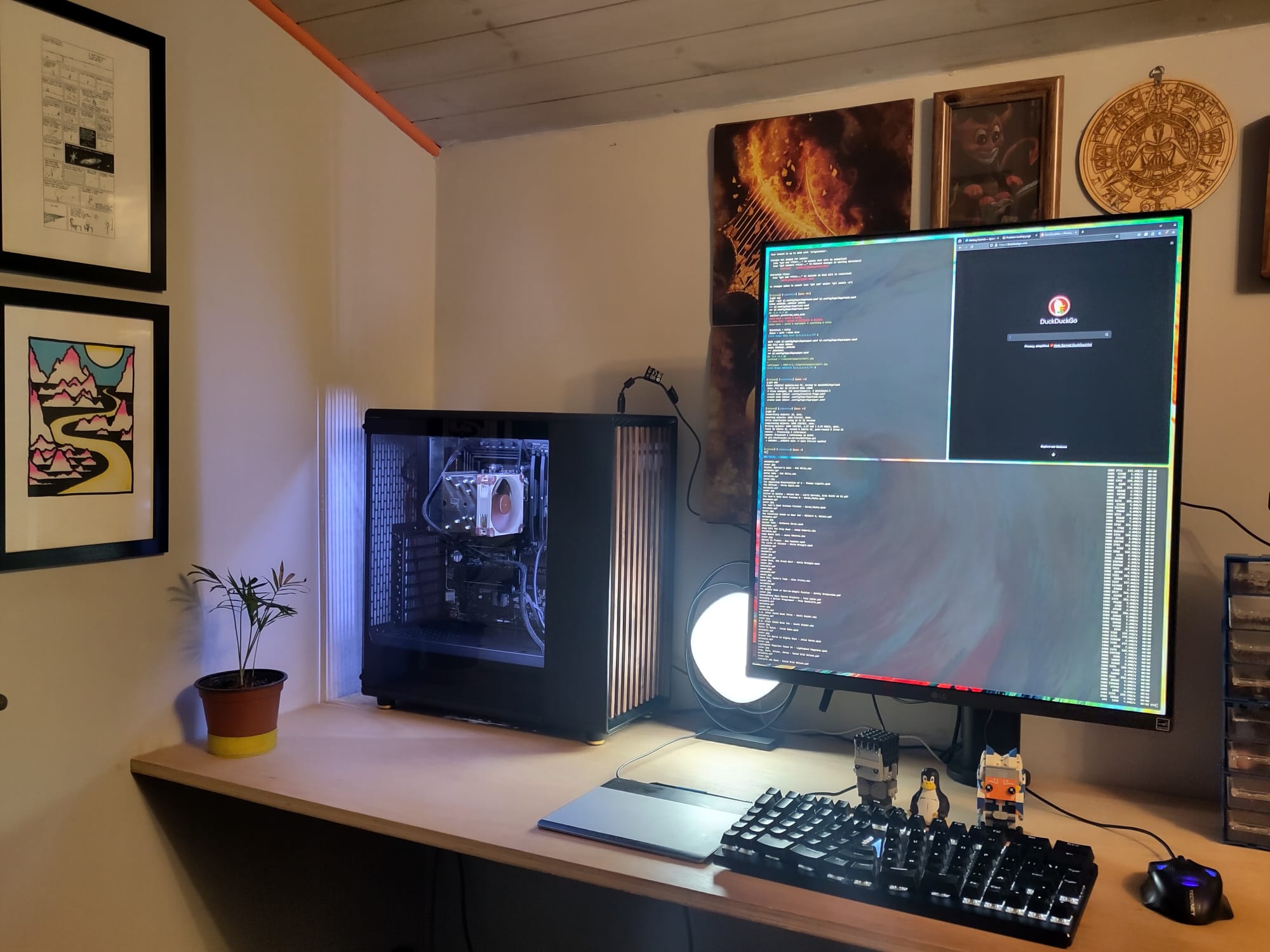 Photo of my office. A PC tower is on a desk next to a portrait monitor.